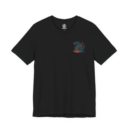 Image 4 of a T-shirt artwork depicting Gogmazios soaring through a smoke-filled sky, its wings coated in thick tar that ignites into blazing fire as it unleashes devastating breath attacks. The battlefield below is consumed by flames and ruin. This design reflects the monster’s overwhelming presence, its siege-breaking strength, and the apocalyptic destruction it brings to fortified cities.