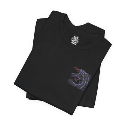 Image 6 of a T-shirt artwork depicting Gore Magala unleashing the Frenzy virus across a ruined battlefield, its dark wings casting a suffocating shadow over hunters below. Purple energy pulses through its body as scales scatter like ash in the wind. This design reflects the monster’s role as a harbinger of madness and transformation, corrupting everything caught within its ominous presence.
