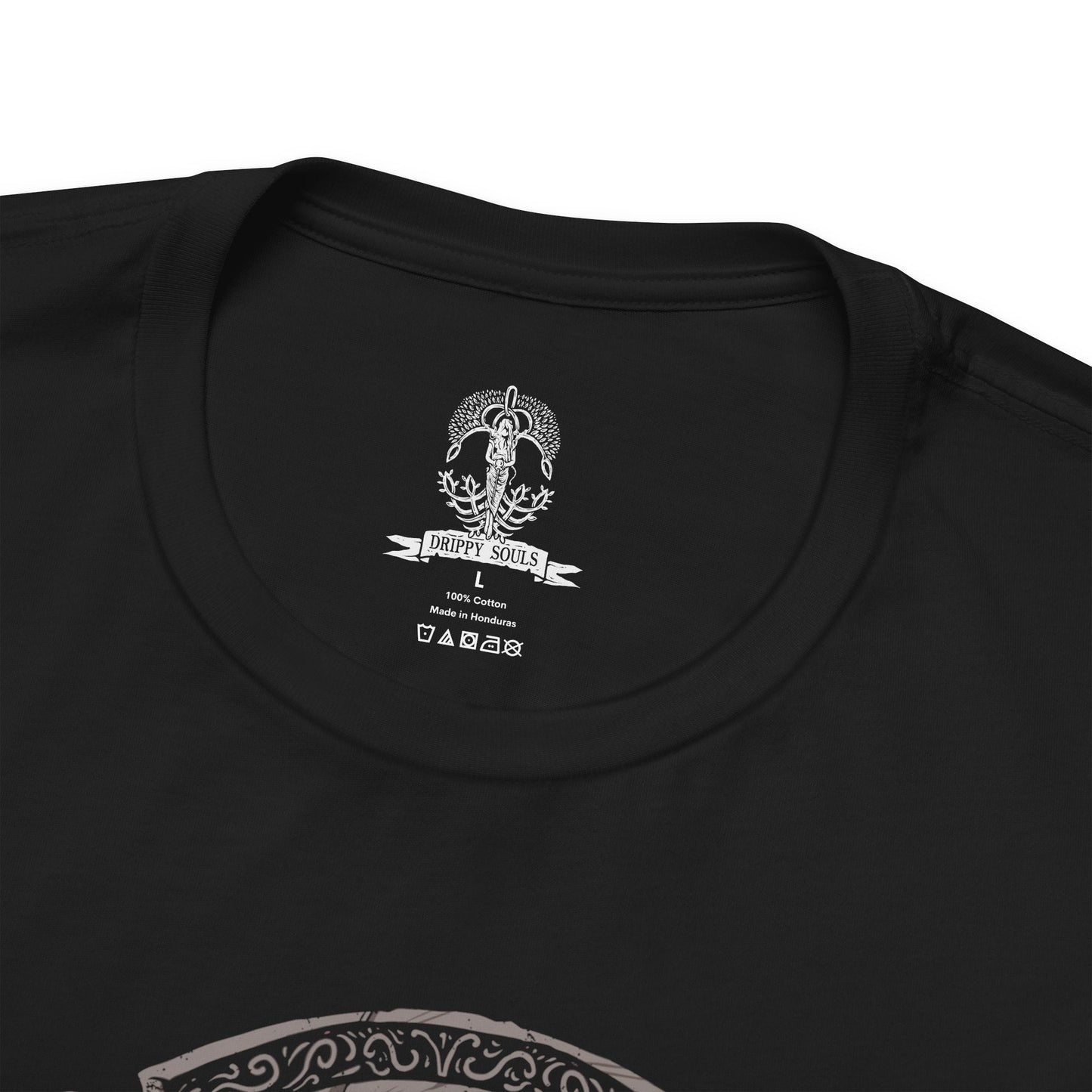 Folded T-Shirt design of Hoarah Loux from Elden Ring, the legendary warrior standing amid the ruins of Leyndell with his massive body covered in battle scars. Golden light and swirling ash surround him as he prepares to unleash his brutal grappling techniques. The design captures the primal strength of the warrior who once ruled as a fierce chieftain before becoming Godfrey, First Elden Lord.