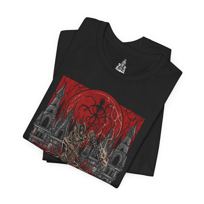 Folded T-shirt featuring a Hunter of Yharnam from Bloodborne, poised beneath a blood moon on the Night of the Hunt. Cloaked in gothic attire and armed with a trick weapon, the Hunter stalks the streets of Yharnam, battling beasts and madness alike. This design captures the eerie, violent elegance of the hunt’s grim ritual.