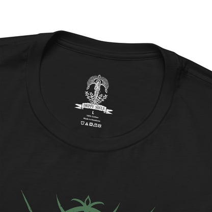 Folded T-shirt design of Ironeye from Elden Ring Nightreign, a mysterious undead archer of the Fellowship standing beneath an endless moonlit sky as the Night’s Tide blankets Limveld. His hooded silhouette draws a longbow with deadly precision while faint green deathlight glows from within his armor. The design captures a silent assassin who fights not to end the night, but to preserve its eternal darkness.