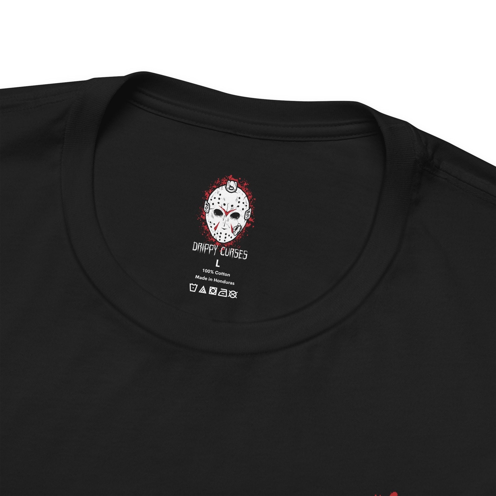 Folded T-Shirt artwork depicting Jason emerging from the waters of Crystal Lake, soaked clothing clinging to his massive frame as ripples spread across the surface. Fog rolls over the shoreline while distant cabins sit abandoned. This design reflects his relentless return, the fear tied to the lake, and the haunting legacy of one of horror’s most iconic slashers.