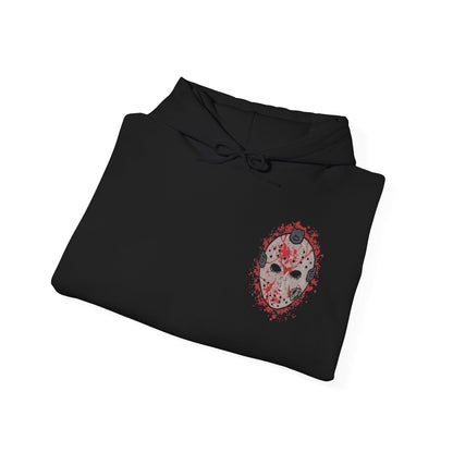 Image 6 of a Hooded Sweatshirt of Jason Voorhees walking through the forest surrounding Crystal Lake, machete in hand as shadows stretch between the trees. His worn hockey mask and silent presence create an atmosphere of dread. The composition emphasizes isolation, inevitability, and the chilling myth of a killer who always comes back.