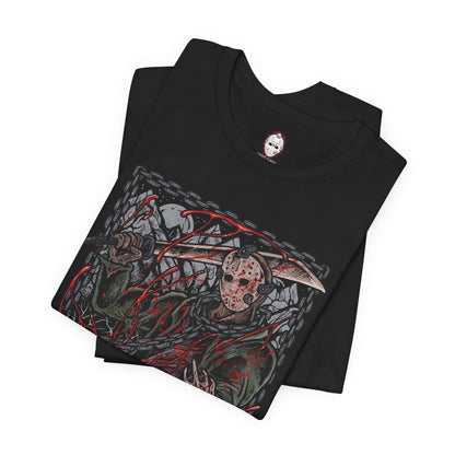 Image 5 of a T-Shirt design of Jason Voorhees from Friday the 13th, standing at the edge of Crystal Lake beneath a moonlit sky. His hockey mask reflects dim light as he grips a bloodstained machete, with trees and cabins fading into darkness behind him. The design captures the eerie silence of the camp and the unstoppable presence of a killer bound to the легенd of Crystal Lake.