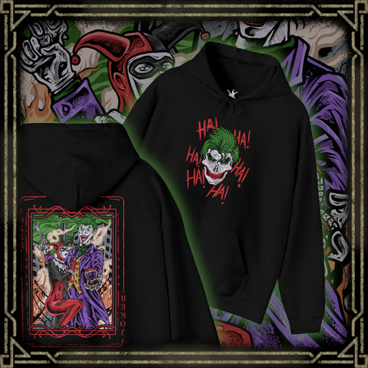 Thumbnail of a Hooded Sweatshirt of the Joker and Harley Quinn seated atop a pile of stolen cash and broken carnival props beneath neon lights. Harley’s colorful outfit contrasts with the Joker’s eerie purple suit as confetti and smoke swirl through the air. The composition emphasizes comic-book chaos, psychological manipulation, and the unforgettable partnership between Gotham’s Clown Prince of Crime and his equally unpredictable accomplice.