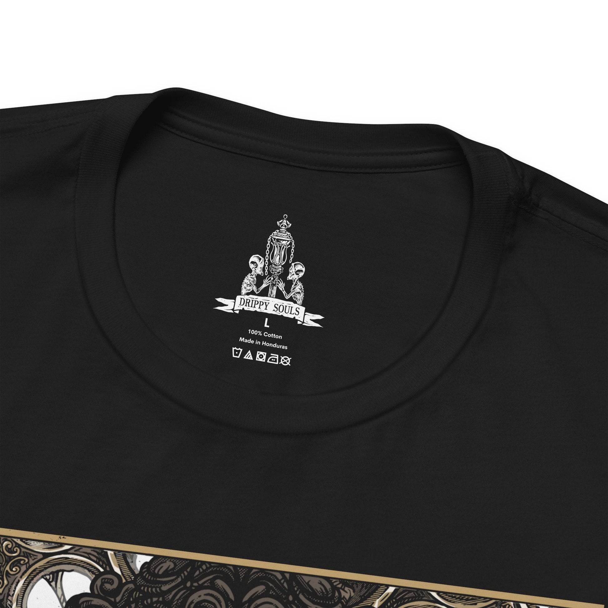 Folded T-shirt featuring Lady Maria of the Astral Clocktower from Bloodborne, the elegant yet deadly guardian of the secretive Research Hall. Once a student of Gehrman and a noble of Cainhurst, Maria abandoned blood arts in shame, only to be bound by duty in the Clocktower. With her Rakuyo blades and flowing black coat, this design captures her grace and sorrow, reflecting the haunting beauty and tragedy of her role in the Old Hunters DLC.