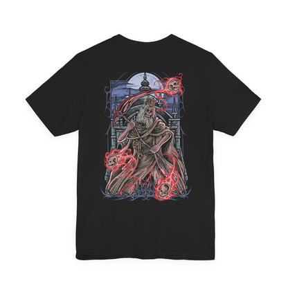 Image 5 of a T-Shirt artwork depicting Martyr Logarius unleashing powerful arcane sorcery across the rooftops of Cainhurst Castle, spectral blades and cursed skulls filling the blizzard-dark sky. Ancient gothic spires rise behind him as frost covers the battlefield. This design reflects his relentless crusade against the Vilebloods, his mastery of forbidden magic, and the tragic fate that bound him to an endless watch.