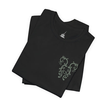 Image 6 of a T-Shirt artwork depicting the Mushroom People wandering through the forgotten depths of Darkroot Garden, surrounded by moss-covered ruins, towering trees, and drifting fog. Their distinctive fungal forms contrast with the dark woodland environment, creating an eerie yet whimsical scene. This design reflects the mysterious creatures hidden within one of Lordran's most atmospheric forests.