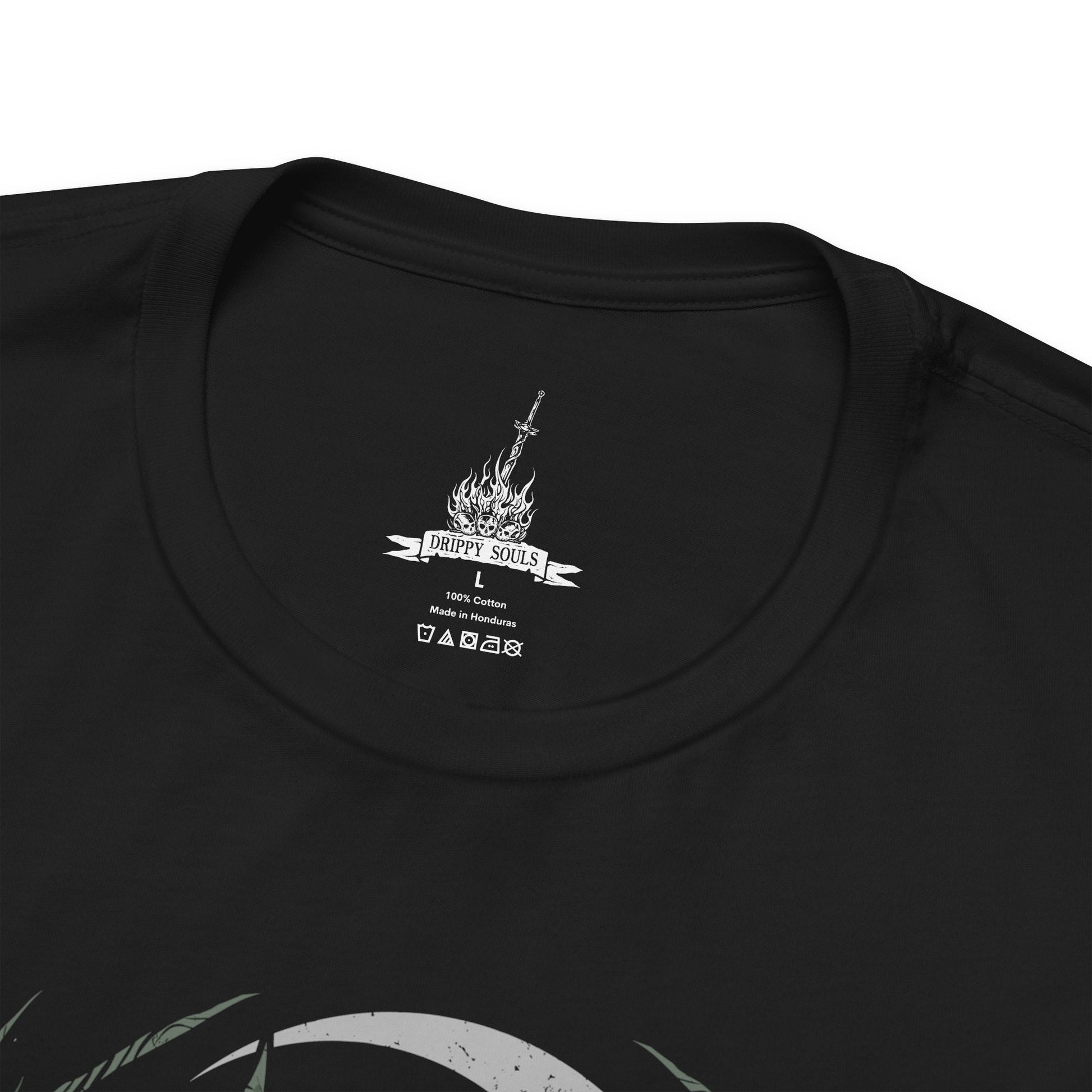 Folded T-Shirt design featuring the Mushroom People of Darkroot Garden from Dark Souls, standing among ancient trees, tangled roots, and thick forest mist. Their oversized mushroom-like bodies emerge from the shadows beneath the canopy while faint sunlight filters through the branches. The design captures the strange, peaceful, and unsettling atmosphere of Darkroot Garden and its mysterious inhabitants.