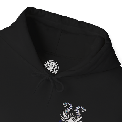 Folded Hooded Sweatshirt of Nakarkos from Monster Hunter Generations, towering within a vast underground cavern filled with enormous bones and shattered monster skulls. The skeletal Elder Dragon extends its tentacles around the battlefield while eerie energy illuminates its grotesque body. Dark stone, scattered remains, and dramatic shadows emphasize the creature's mysterious and terrifying presence.