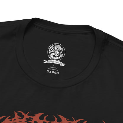 Folded T-Shirt design of Odogaron from Monster Hunter, prowling through the blood-soaked depths of the Rotten Vale with crimson skin stretched over powerful muscles and razor-sharp claws ready to strike. Bones and decaying remains litter the ground while eerie mist rises from the cavern floor. The design captures Odogaron's unmatched speed, feral aggression, and relentless hunting instincts within one of the New World's most terrifying ecosystems.