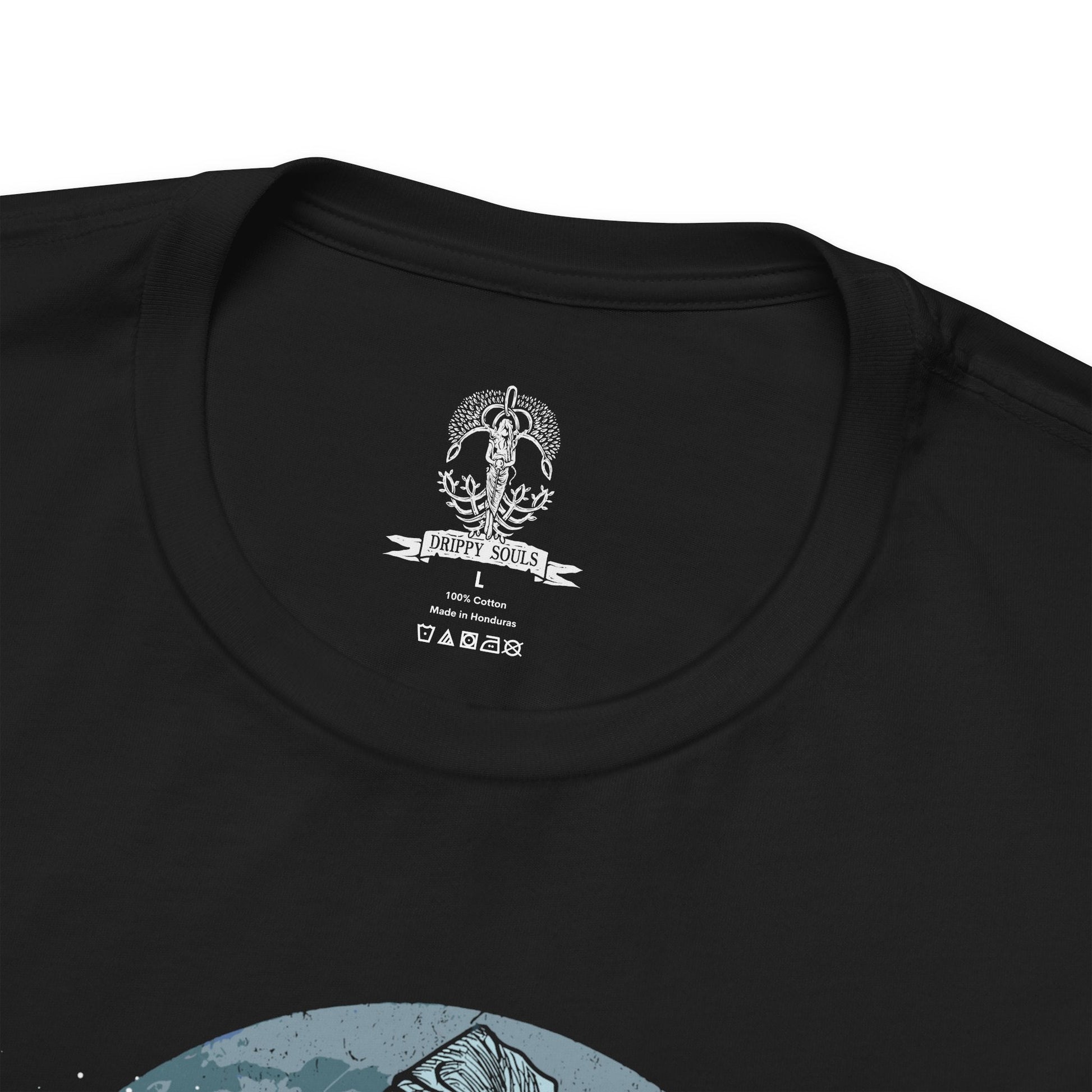 Folded T-shirt featuring Ranni the Witch from Elden Ring, the mysterious Lunar Princess and Empyrean who defied the Greater Will. Draped in a flowing blue cloak and crowned with her wide-brimmed witch’s hat, Ranni embodies quiet rebellion and arcane mystery. With her ethereal doll form and ties to the stars, she offers one of the game’s most profound and emotional questlines, symbolizing fate, sacrifice, and cosmic ambition.