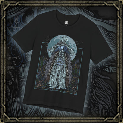 Thumbnail of a T-shirt featuring Ranni the Witch from Elden Ring, the mysterious Lunar Princess and Empyrean who defied the Greater Will. Draped in a flowing blue cloak and crowned with her wide-brimmed witch’s hat, Ranni embodies quiet rebellion and arcane mystery. With her ethereal doll form and ties to the stars, she offers one of the game’s most profound and emotional questlines, symbolizing fate, sacrifice, and cosmic ambition.