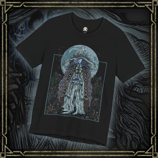 Thumbnail of a T-shirt featuring Ranni the Witch from Elden Ring, the mysterious Lunar Princess and Empyrean who defied the Greater Will. Draped in a flowing blue cloak and crowned with her wide-brimmed witch’s hat, Ranni embodies quiet rebellion and arcane mystery. With her ethereal doll form and ties to the stars, she offers one of the game’s most profound and emotional questlines, symbolizing fate, sacrifice, and cosmic ambition.