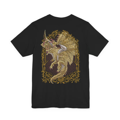 Image 5 of a T-Shirt artwork depicting Shagaru Magala spreading its immense wings above a devastated battlefield, golden energy and Frenzy scales radiating outward like a celestial storm. Its glowing horns and elegant form contrast with the destruction surrounding it, reflecting the duality of beauty and catastrophe. This design emphasizes the Elder Dragon's godlike presence and its role as the source of the devastating Frenzy virus.