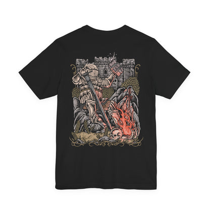 Image 5 of a T-Shirt artwork depicting Siegward of Catarina standing within the depths of Yhorm's throne room, his iconic Catarina armor illuminated by fire and fading light. The Onion Knight raises his weapon as the enormous figure of Yhorm the Giant looms in the background. The design reflects their friendship, Siegward's solemn promise, and his final act of loyalty.