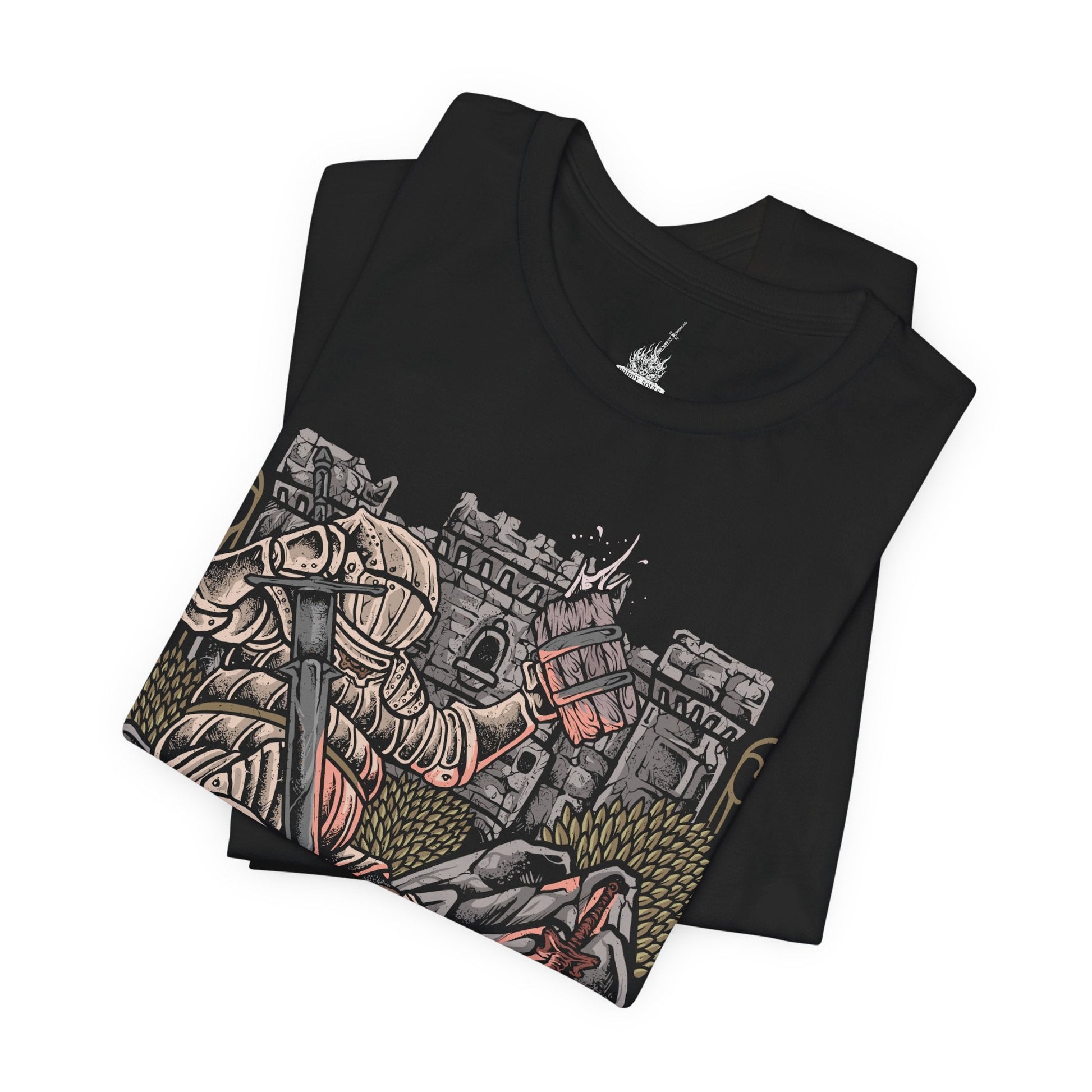 Image 5 of a T-Shirt design of Siegward of Catarina from Dark Souls III, standing proudly in his distinctive rounded Catarina armor while gripping his weapon inside a ruined castle. Warm light, smoke, and ancient stone surround the Onion Knight as he prepares for battle. The design captures Siegward's courage, loyalty, humor, and unwavering commitment to keeping his promises.