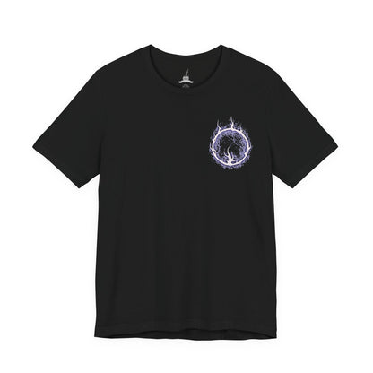 Image 4 of a T-Shirt artwork depicting Lorian, Elder Prince, kneeling amid the ashes of Lothric Castle while Lothric rests upon his back and prepares to unleash radiant magic. Golden light contrasts with Lorian's dark, flame-scarred armor as the brothers face their final battle. This design reflects their shared curse, unwavering devotion, and the tragic relationship at the heart of the Princes' story.