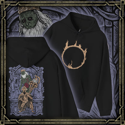 Thumbnail of a Hooded Sweatshirt of Velstadt kneeling before the throne of King Vendrick, dark aura radiating from his armor while the silence of the crypt surrounds him. His massive hammer rests against shattered stone as ghostly candlelight flickers across ancient walls. The composition emphasizes devotion, ruin, and the tragic solitude of a knight who remained loyal long after his kingdom fell.