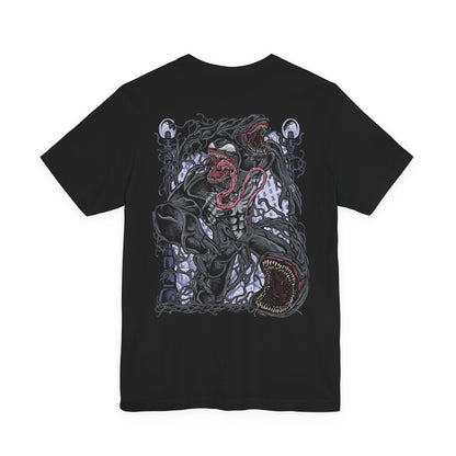 Image 5 of a T-Shirt artwork depicting Venom lunging from the shadows with claws extended, black symbiote tendrils whipping through the air around him. Rain falls across a dark city skyline while his white spider emblem glows against the living suit. This design reflects raw aggression, chaotic strength, and the relentless hunger that makes Venom one of Marvel’s most iconic antiheroes.