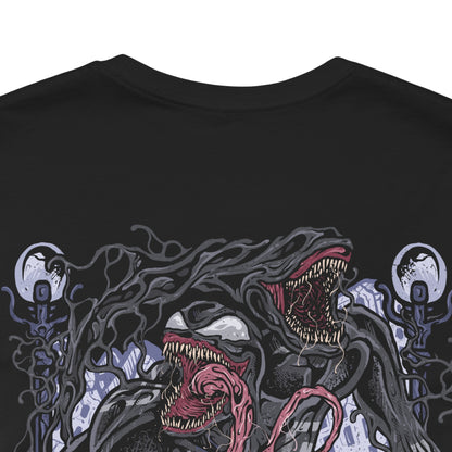 Image 7 of a T-Shirt artwork depicting Venom lunging from the shadows with claws extended, black symbiote tendrils whipping through the air around him. Rain falls across a dark city skyline while his white spider emblem glows against the living suit. This design reflects raw aggression, chaotic strength, and the relentless hunger that makes Venom one of Marvel’s most iconic antiheroes.