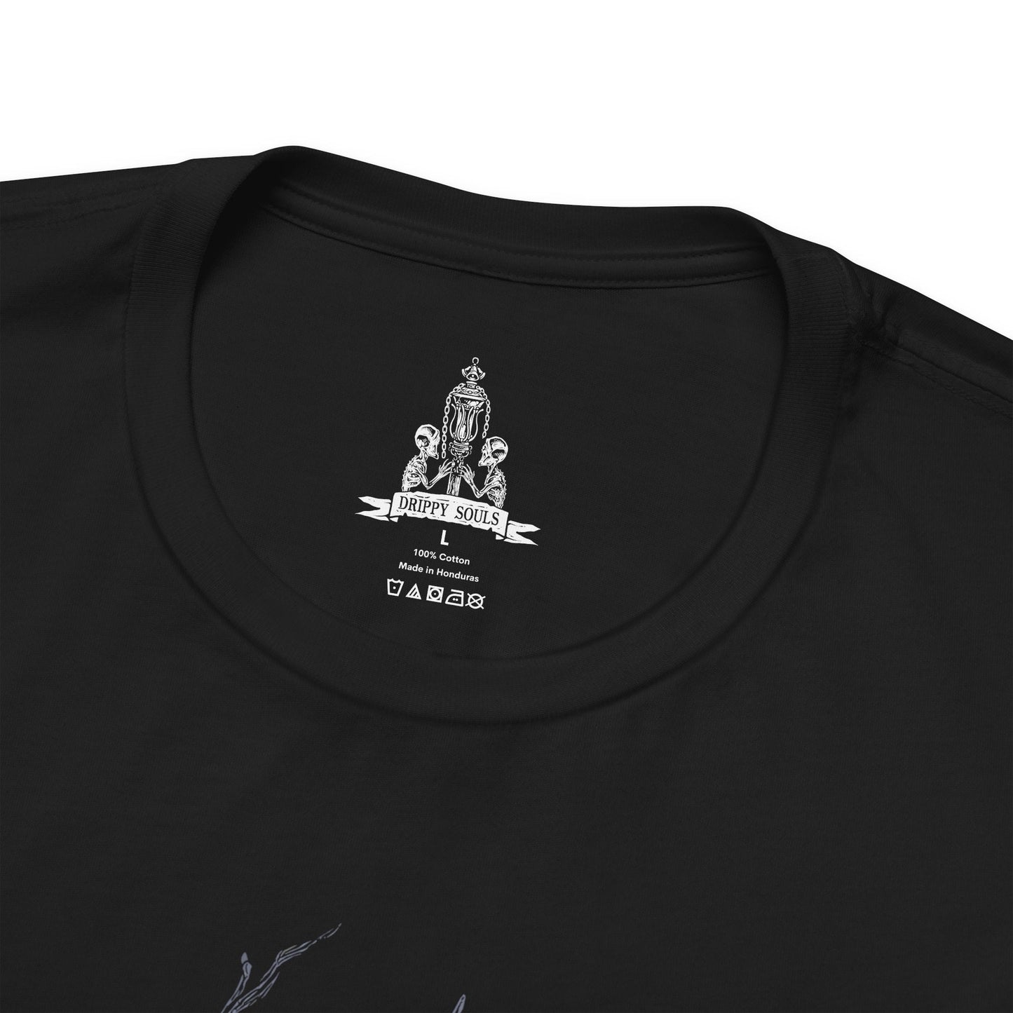 Folded T-shirt featuring Vicar Amelia from Bloodborne, the once-devout leader of the Healing Church transformed into a towering beast of fur and sinew. Clutching a sacred pendant in her grotesque paws, Amelia symbolizes the church’s descent into corruption. This design captures her dramatic shift from cleric to monster, framed in gothic horror and divine tragedy under the pale moonlight.