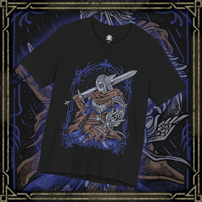 Thumbnail of a T-shirt design of Wylder from Elden Ring Nightreign, a hardened Nightfarer warrior standing beneath a storm-dark sky as the Night’s Tide spreads across Limveld. His worn armor and rune-etched blade glow with faint spectral light while distant monsters emerge from the darkness. The design captures a lone champion rising against the Nightlord’s spreading corruption.